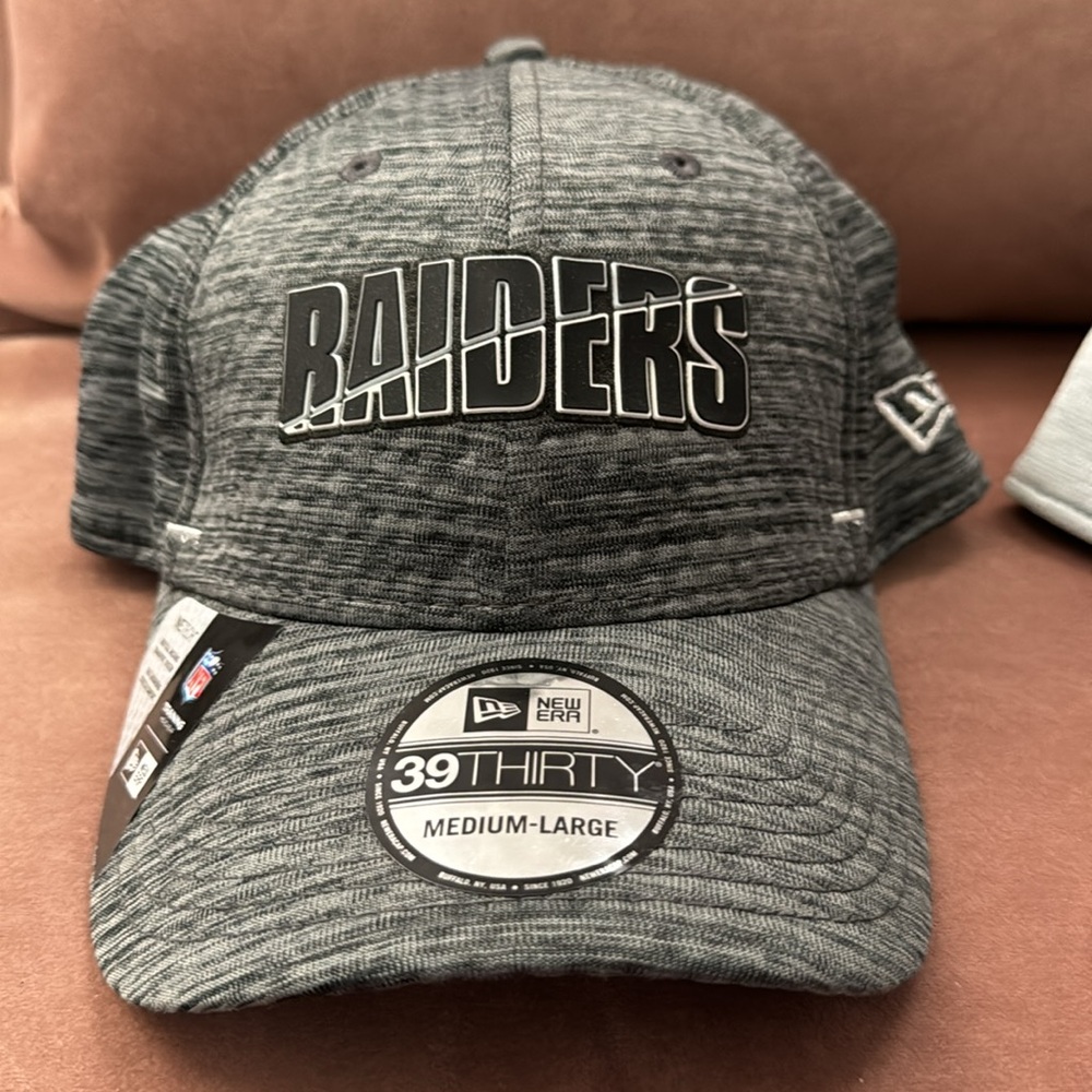 Raiders 2 brand new , never worn baseball style hats with stickers still on.